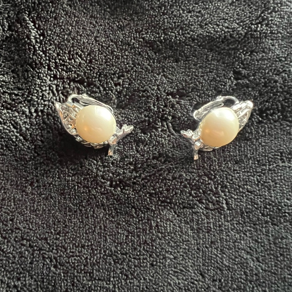 Clip On Earrings  White Pearl Color Stones and Silver Colored Leaf.
